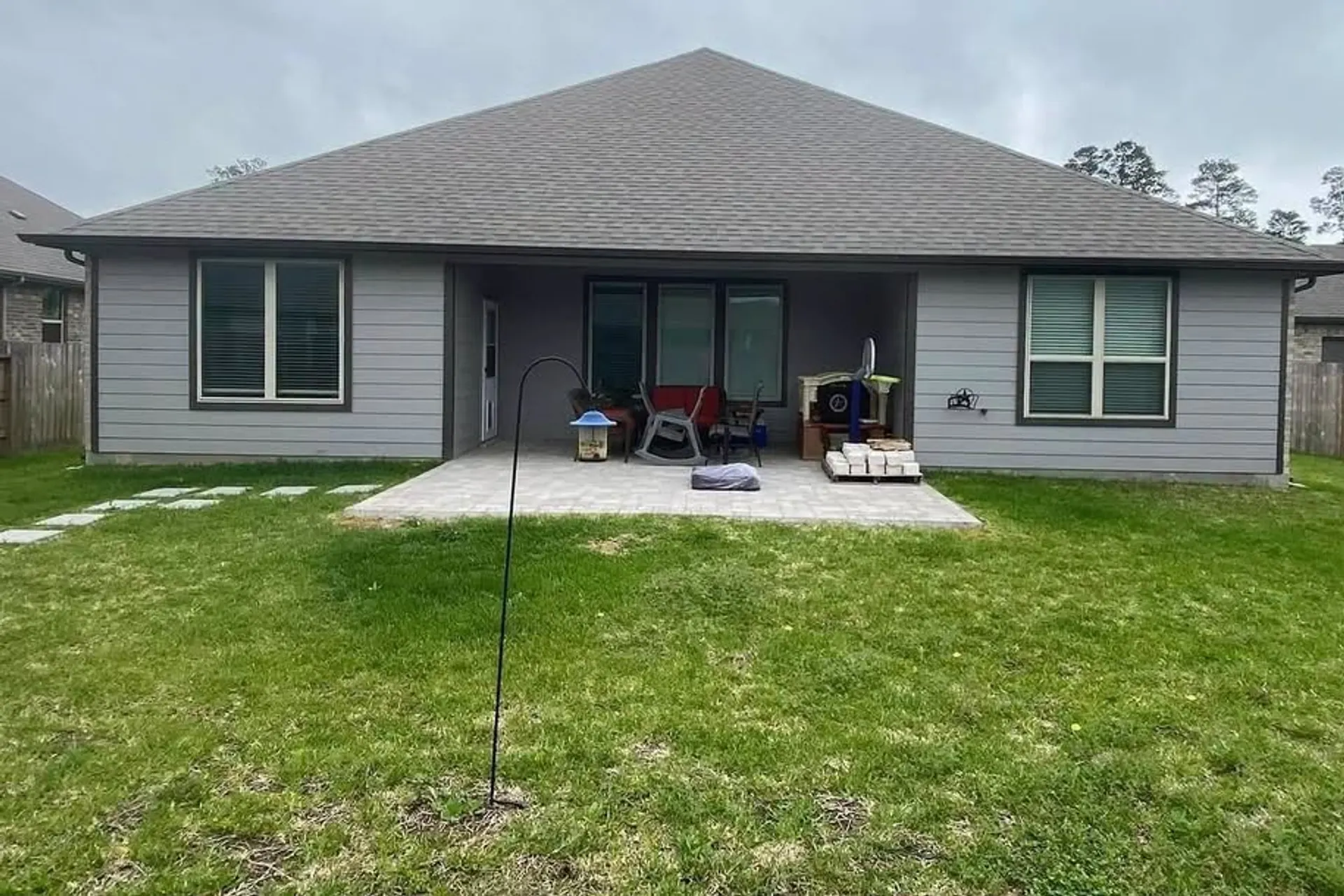New concrete back patio poured behind a Houston-area home