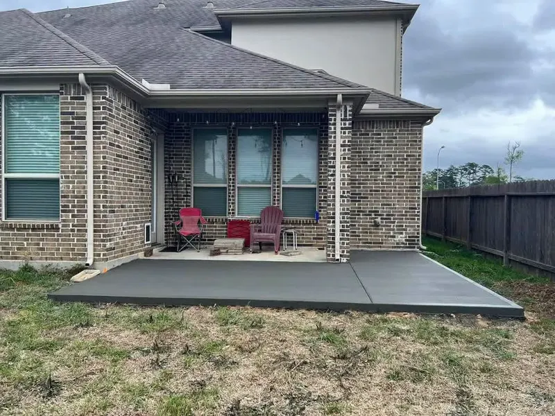 Patio extension added to a covered brick patio