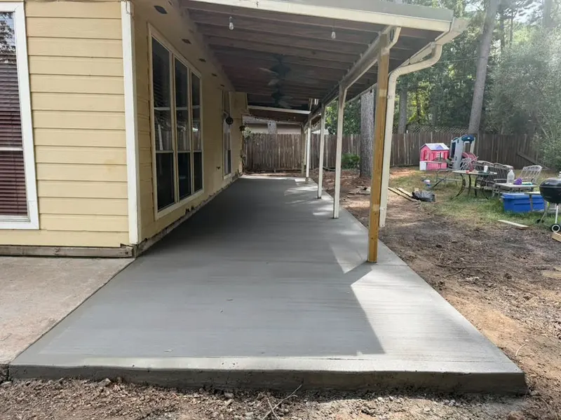 Long covered patio slab running the length of a home